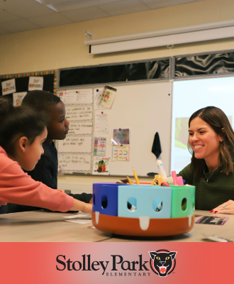 Photo of Mrs. Splatts smiling with two students in her classroom over the logo for Stolley Park.